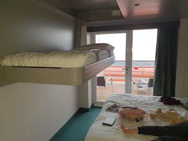 Showing the bed dropped from the ceiling restricting access to the balcony