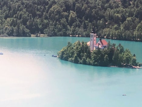 Photo of the church on the island in the middle of Lake Bled, take from the