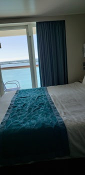 Balcony stateroom with king-sized bed. 