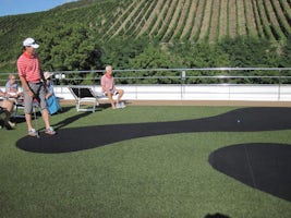 Putting contest. Look at vineyards in background.amazing.