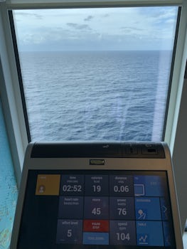 At the gym working out overlooking the ocean