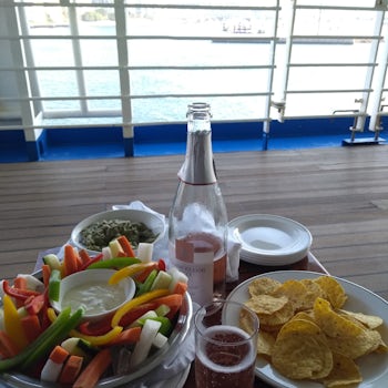 Pre-ordered crudites and dip and Gucamole and corn chips enjoyed on Deck 7 