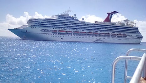 The Sunshine Ship anchored while we were at Princess Cay, their private & f