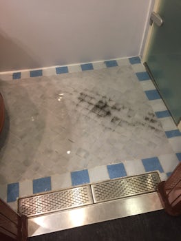 Water and black discharge from floor drain
