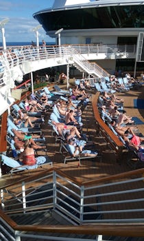 Looking for a seat at the poolside? Get there early. 