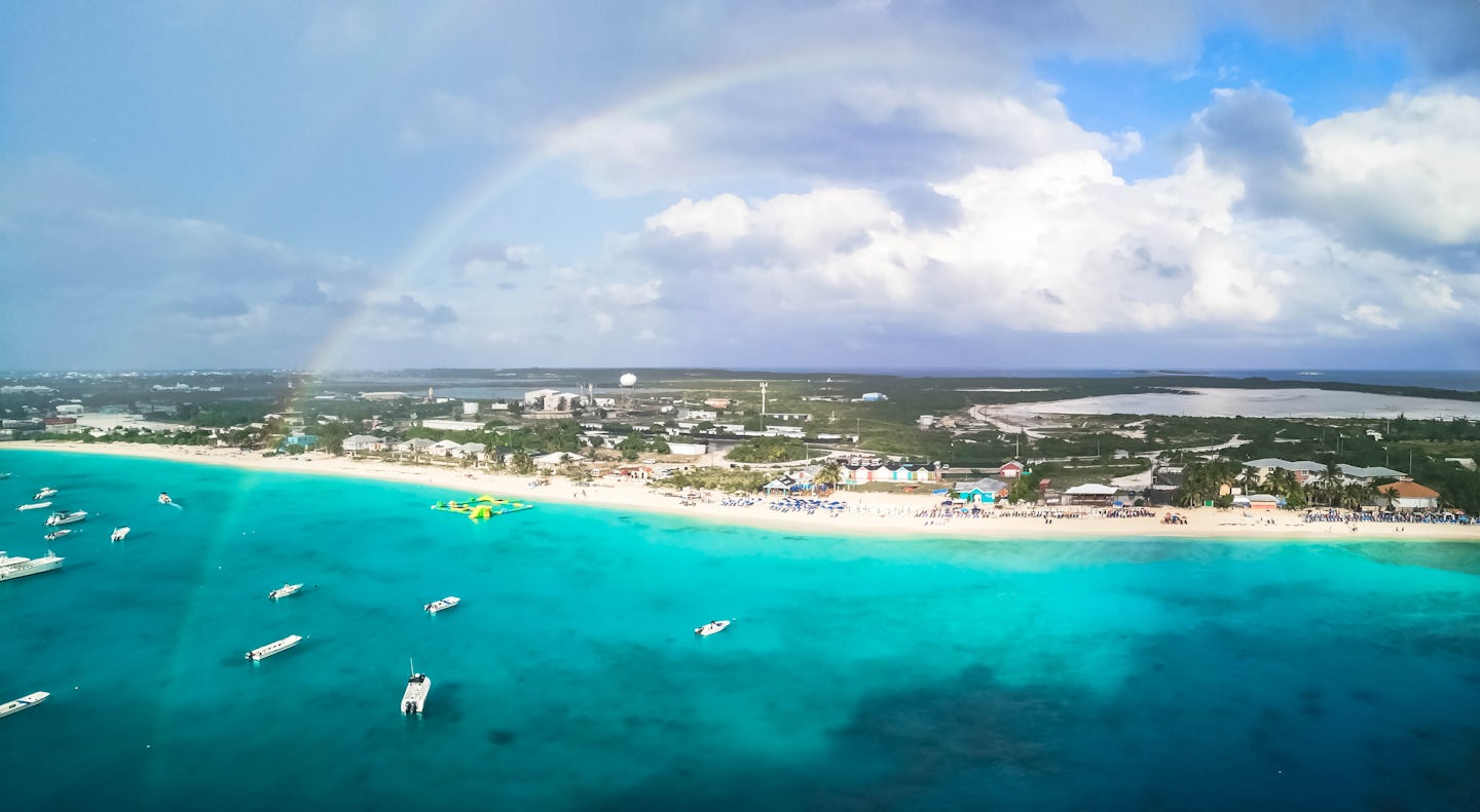 Grand Turk beach from the ship with a rainbow