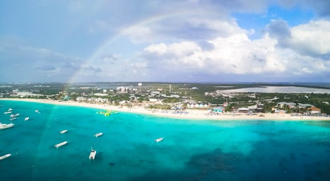 Grand Turk beach from the ship with a rainbow