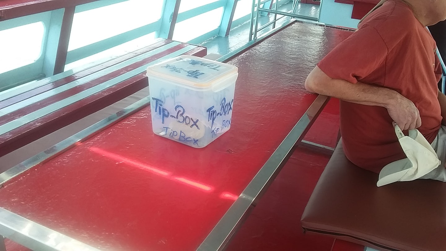 tip box that is shoved in your face on disembarkation from tender to Koh Sa