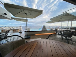Main outdoor area on Deck 3. Pool, lounge chairs and informal dining room (