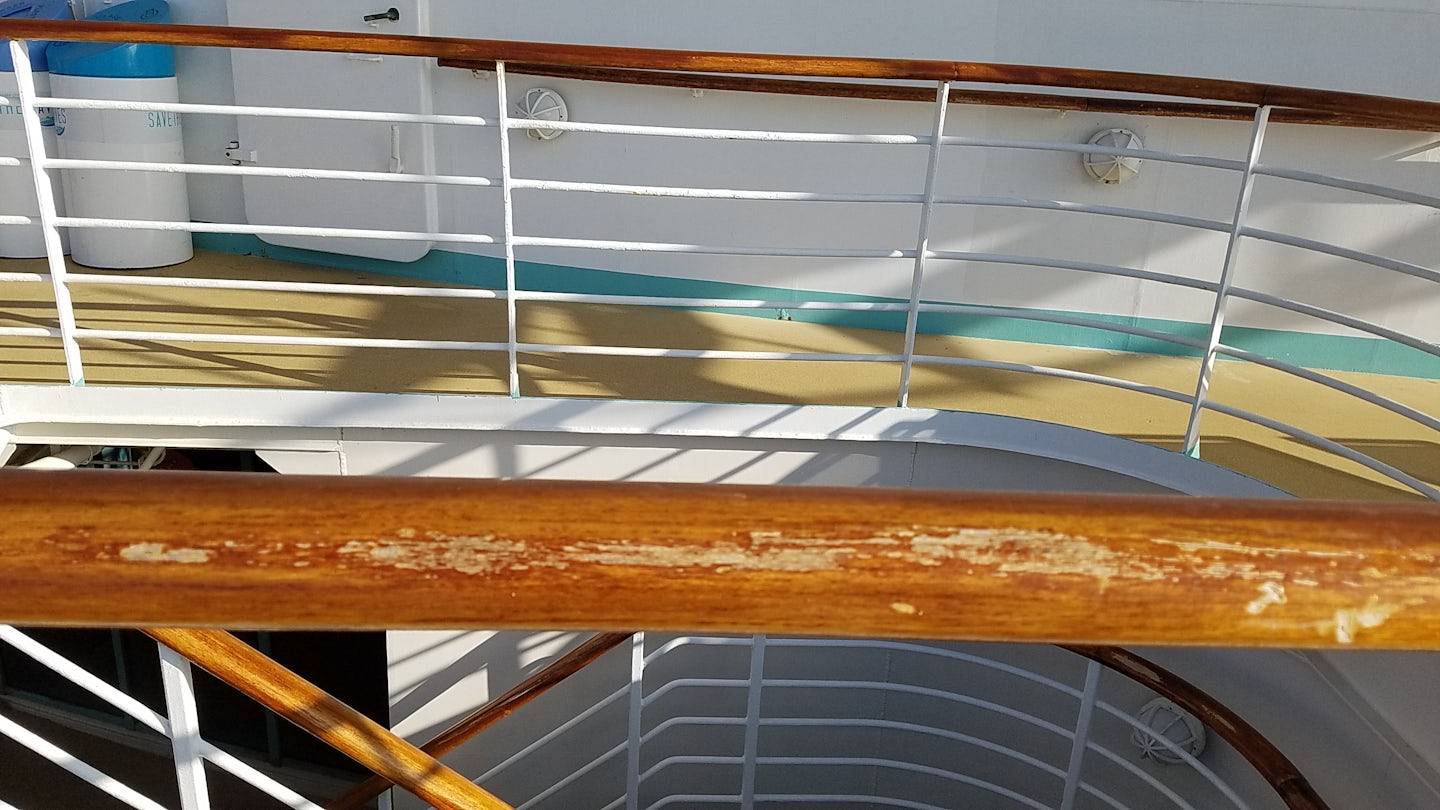 Banisters worn to bare wood throughout the ship 