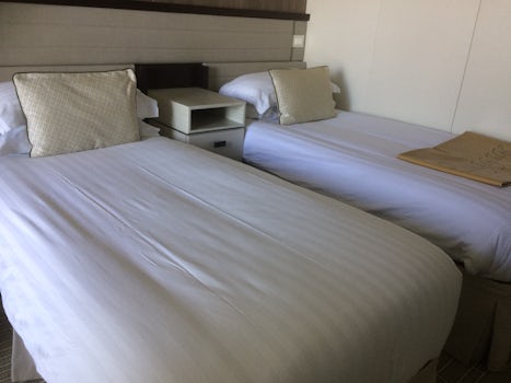 This is the beds In the cruise ship cabin.