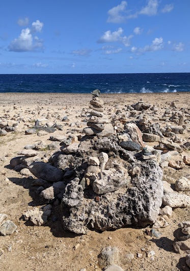 This was on a rugged stretch of beach in Aruba near the Bushiribana Ruins.   The beach was covered with these impromptu "sculptures" of rocks and shells piled up artistically.  What a sight to see hundreds of feet of beach filled with these!