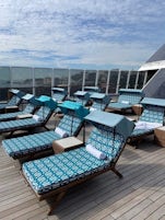 For those in Penthouses and above you have complimentary access to the Spa Terrace.  The loungers have been upgraded during the Oceania Next program