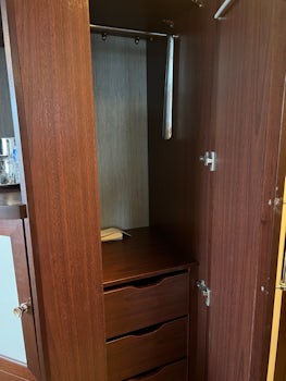 Hanging space and drawers next to closet