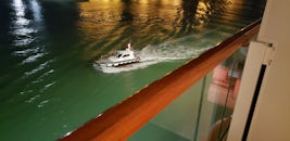 Taken from my cabin balcony, the Pilot boat leaving after we departed one evening.