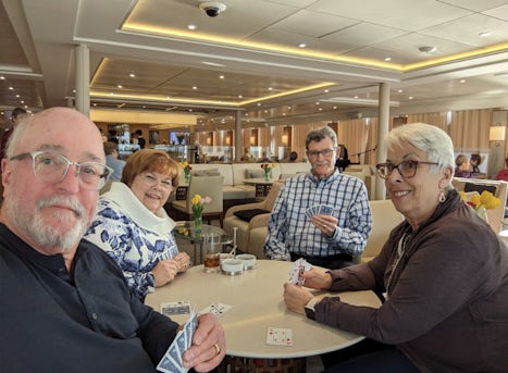 A little Euchre with new friends in the lounge while the ship sails to the next port.