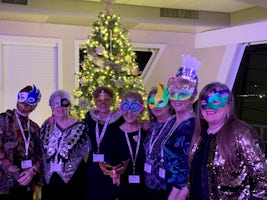 Friends on New Year's celebration wearing masks we made in Arts and Crafts Class