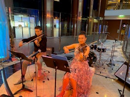 Violin Duo performed around the ship. Classical, Contemporary, Pop. 