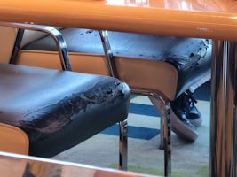 Chairs needing replaced. The pieces were sticking to passengers clothing as they left. Why would you not address this?  Terrible.