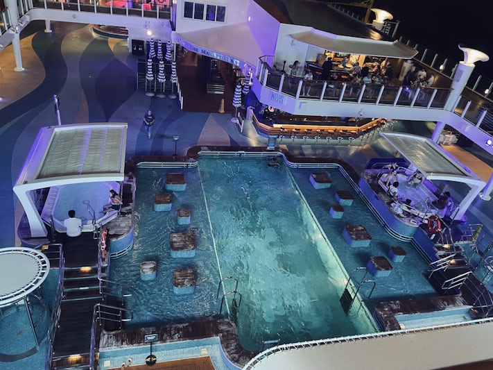 The pool at night with lounge chairs removed.