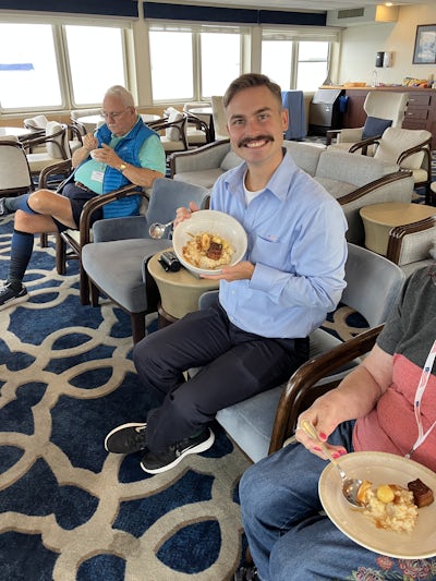 That is a picture of our cruise director with his bowl of a scrumptious creation our chef made one day as an activity.