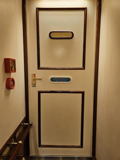 Owner's Cabin - the red boxes on the left are a "break glass for key" method to get into the room in case the emergency escape needs to be used.