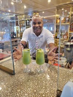 Hassan in the bar with the lemon mint drinks 