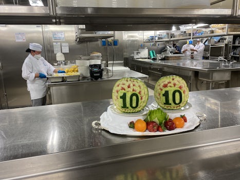Tour of the kitchens on the ship, a carved melon awarding the kitchen 10 out of 10. 