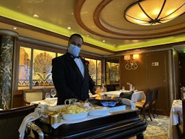 Dairy free crepe suzette being prepared in the Queens Grill