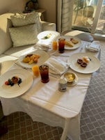 The butler will use a full size table top (stored in the closet) when setting up room service breakfast.
