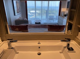 View from bath to balcony through sliding mirror