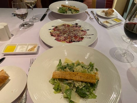 Prego Specialty Restaurant (Italian) Cesar Salad and Beef Carpaccio done table side.