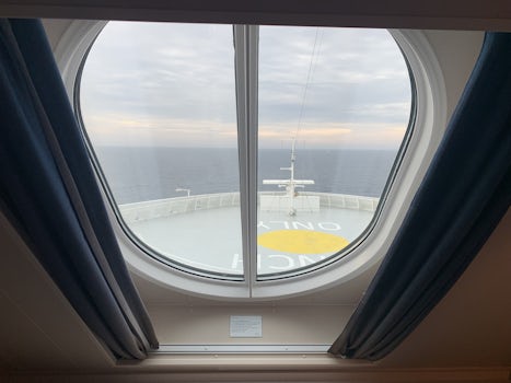 Looking out the ocean window from stateroom 10100 on the NCL Bliss.
