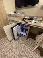 Refrigerator and 4 drawers with desk area. 