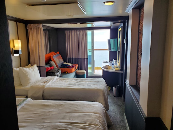 Our Balcony Cabin Suite on the Jewel.  We put some of the suitcases on the sofa and some under the bed and closet for the duration.  Tight rooms for two.