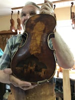 Violin maker and repairer, Jan Nemcek - this violin is centuries old, was broken and Jan repaired it.