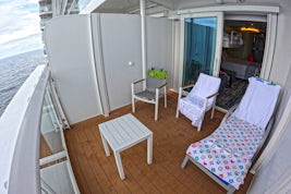 Balcony cabin Carnival Mardi Gras - longer than basic with no additional cost, can accommodate a lounger if you ask for it