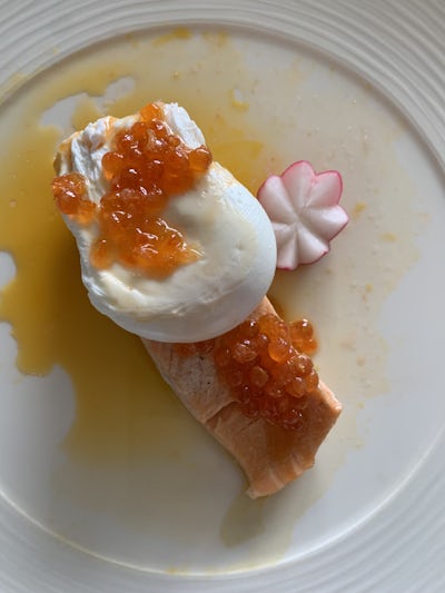 Poached salmon with poached egg and salmon caviar
