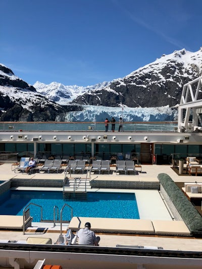 The mid ship pool with its roof retracted with people enjoying the unseasonably hot day as we cruise by beautiful Alaskan glaciers!