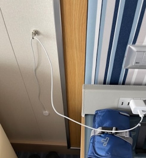 We used small magnets to help keep charging cords off night tables when not in use.