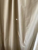 The curtains had holes in them.