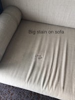 Sofa dried up stain from previous guests 
