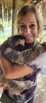 I was holding a pregnant sloth!  She was amazing!