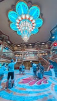 Atrium of Disney Dream. Capitan Mickey and Cruise Director Minnie Mouse greet families with a song and dance! 