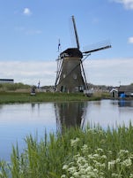 One of the 19 working polder mills in Kinderdijk - - The small mill to the left is not a toy. Children use them learn the basics of mill operation so one day they can become millers as well. 