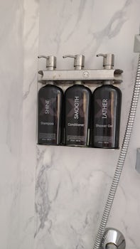 Shampoo, conditioner and body wash inside shower