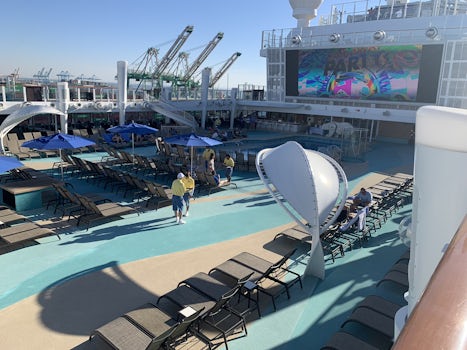 Looking down on Deck 16 (pool area) from Deck 17 and the large video screen.