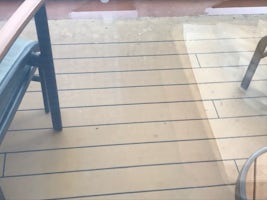 Veranda floor, table and chairs were dirty.  Balcony glass partition was filthy.